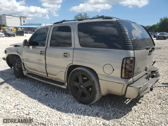 2002 GMC Yukon Denali with VIN 1GKEK63U12J154624, listed as a Copart auction lot 73827304 with 165,518 mi miles and Salvage Title. Bid and sale history available at carsss.com. Image 2.
