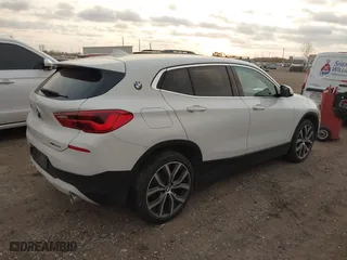 2020 BMW X2 sDrive28i with VIN WBXYH9C02L5R10335, listed as a IAAI auction lot 40651317 with 67,897 mi miles. Bid and sale history available at carsss.com. Image 4.