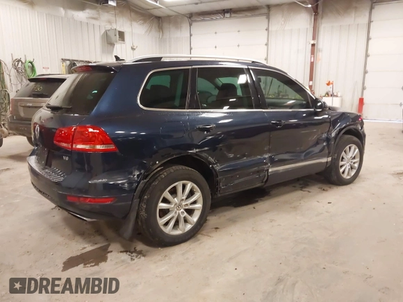 2014 Volkswagen Touareg Sport with VIN WVGEF9BP9ED008967, listed as a IAAI auction lot 41984409 with 193,859 mi miles and . Bid and sale history available at DreamBid. Image 4.