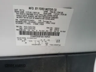 2016 Ford Taurus SEL z VIN 1FAHP2E87GG146931, wystawiony jako Copart lot #56135655 z przebiegiem 99 733 mil mil oraz Szkoda całkowita • Salvage title. Historia ofert i sprzedaży dostępna na DreamBid. Obrazek 12.