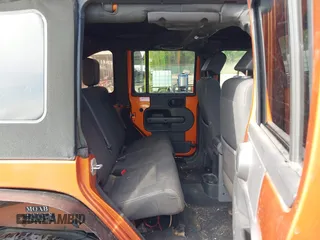 2010 Jeep Wrangler Unlimited Sport with VIN 1J4HA3H1XAL189667, listed as a IAAI auction lot 42062351 with 144,838 mi miles. Bid and sale history available at carsss.com. Image 8.