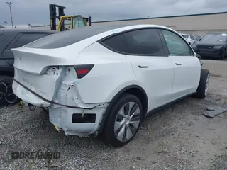 2023 Tesla Model Y Long Range z VIN 7SAYGDEE9PF623285, wystawiony jako IAAI lot #41383184 z przebiegiem 34 092 mil mil oraz . Historia ofert i sprzedaży dostępna na DreamBid. Obrazek 4.