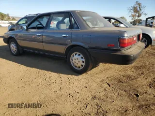 1989 Toyota Camry z VIN JT2SV21E8K0314703, wystawiony jako Copart lot #76053194 z przebiegiem 124 873 mil mil oraz Nie do naprawy • Non repairable. Historia ofert i sprzedaży dostępna na DreamBid. Obrazek 2.