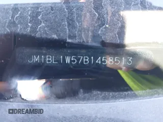 2011 Mazda 3 S Grand Touring with VIN JM1BL1W57B1458513, listed as a IAAI auction lot 41585432 with Not Provided miles and . Bid and sale history available at DreamBid. Image 9.