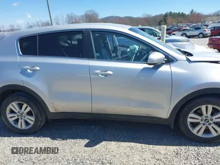 2019 Kia Sportage LX z VIN KNDPM3AC4K7591148, wystawiony jako IAAI lot #41826009 z przebiegiem Nie podano mil oraz . Historia ofert i sprzedaży dostępna na DreamBid. Obrazek 13.