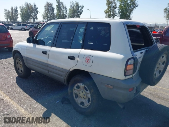 1999 Toyota RAV4 with VIN JT3GP10V2X7064915, listed as a IAAI auction lot 41998544 with 302,351 mi miles and . Bid and sale history available at DreamBid. Image 3.