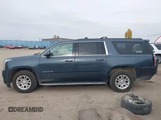 2019 GMC Yukon XL SLT with VIN 1GKS2GKC0KR345860, listed as a IAAI auction lot 40727072 with 127,568 mi miles and . Bid and sale history available at carsss.com. Image 15.