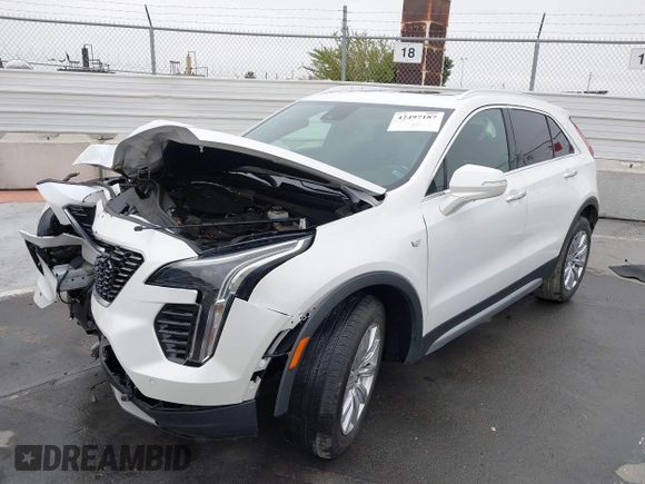 2022 Cadillac XT4 FWD Premium Luxury with VIN 1GYFZCR49NF100393, listed as a IAAI auction lot 42497187 with 23,672 mi miles and . Bid and sale history available at DreamBid. Image 2.