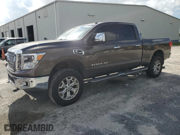 2016 Nissan Titan XD Platinum Reserve with VIN 1N6BA1F20GN500500, listed as a Copart auction lot 75396354 with 164,966 mi miles and Salvage Title. Bid and sale history available at carsss.com. Image 1.