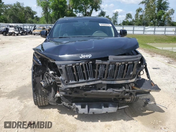 2013 Jeep Grand Cherokee Laredo with VIN 1C4RJEAG2DC519570, listed as a Copart auction lot 52066225 with 129,091 mi miles and Salvage Title. Bid and sale history available at carsss.com. Image 5.