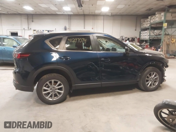 2023 Mazda CX-5 2.5 S Carbon Edition with VIN JM3KFBCM4P0289998, listed as a IAAI auction lot 41297074 with 19,303 mi miles. Bid and sale history available at carsss.com. Image 13.