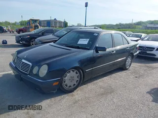 1997 Mercedes-Benz E-Class with VIN WDBJF55F7VJ027080, listed as a IAAI auction lot 42120838 with 150,197 mi miles. Bid and sale history available at carsss.com. Image 2.