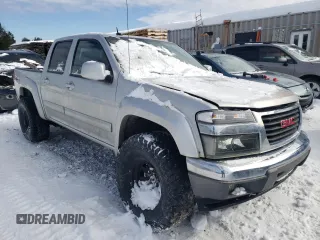 2011 GMC Canyon SLT with VIN 1GTH6NFE2B8117617, listed as a Copart auction lot 43222695 with 146,277 mi miles and Salvage Title. Bid and sale history available at carsss.com. Image 4.