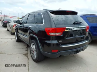 2013 Jeep Grand Cherokee Overland with VIN 1C4RJECT2DC588124, listed as a IAAI auction lot 42142573 with 204,309 mi miles and . Bid and sale history available at DreamBid. Image 3.