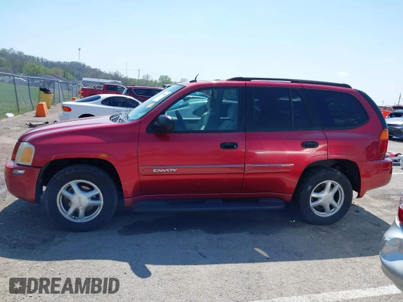 2005 GMC Envoy SLT with VIN 1GKDS13SX52144959, listed as a IAAI auction lot 41968495 with 238,199 mi miles. Bid and sale history available at carsss.com. Image 14.