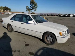 1995 Mercedes-Benz S 320 with VIN WDBGA32E8SA252144, listed as a Copart auction lot 77053484 with 126,534 mi miles and Clean Title. Bid and sale history available at DreamBid. Image 4.