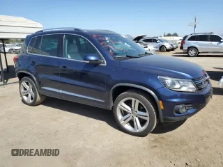 2015 Volkswagen Tiguan SE with VIN WVGAV7AX2FW094359, listed as a Copart auction lot 60101885 with 106,305 mi miles and Salvage title. Bid and sale history available at DreamBid. Image 4.