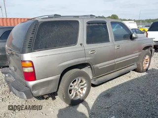 2001 Chevrolet Tahoe LS z VIN 1GNEC13T51R154488, wystawiony jako IAAI lot #41519004 z przebiegiem 400 208 mil mil oraz . Historia ofert i sprzedaży dostępna na DreamBid. Obrazek 4.