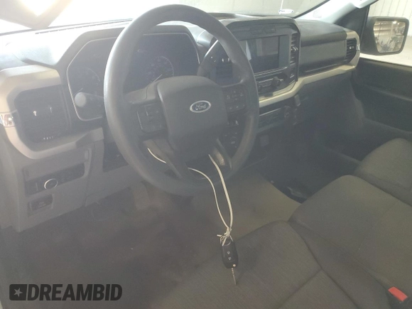 2021 Ford F-150 XL with VIN 1FTMF1EB4MKE11721, listed as a Copart auction lot 65990284 with Not provided miles and Salvage title. Bid and sale history available at DreamBid. Image 8.