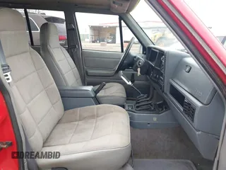 1995 Jeep Cherokee Sport with VIN 1J4FJ68S7SL582142, listed as a IAAI auction lot 41749115 with 185,676 mi miles. Bid and sale history available at carsss.com. Image 5.