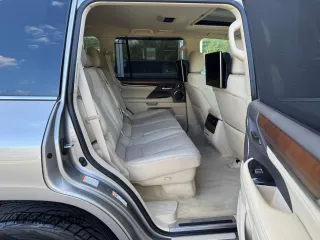 2016 Lexus LX 570 with VIN JTJHY7AX4G4198811, listed as a Copart auction lot 64898475 with 107,759 mi miles and Clean title. Bid and sale history available at DreamBid. Image 6.