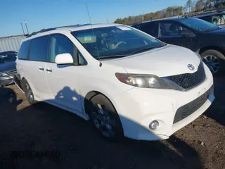 2014 Toyota Sienna SE with VIN 5TDXK3DC1ES503751, listed as a IAAI auction lot 41709975 with 229,771 mi miles. Bid and sale history available at carsss.com. Image 1.