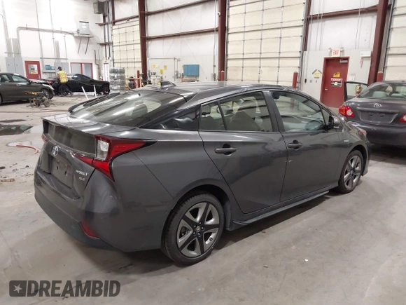 2020 Toyota Prius L Eco with VIN JTDKARFU1L3117299, listed as a IAAI auction lot 42544586 with 42,560 mi miles and . Bid and sale history available at DreamBid. Image 4.