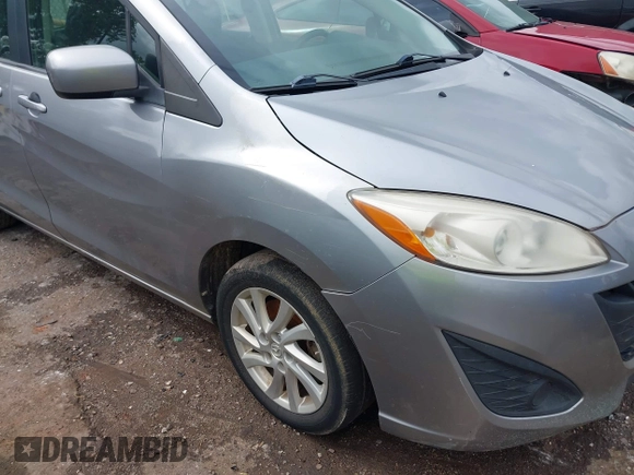 2012 Mazda 5 Sport with VIN JM1CW2BL0C0111151, listed as a IAAI auction lot 42359887 with 158,986 mi miles and . Bid and sale history available at DreamBid. Image 6.