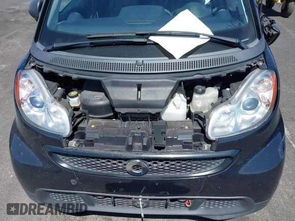 2015 Smart fortwo Passion z VIN WMEEJ3BA0FK812651, wystawiony jako IAAI lot #42063112 z przebiegiem 25 270 mil mil oraz . Historia ofert i sprzedaży dostępna na DreamBid. Obrazek 10.