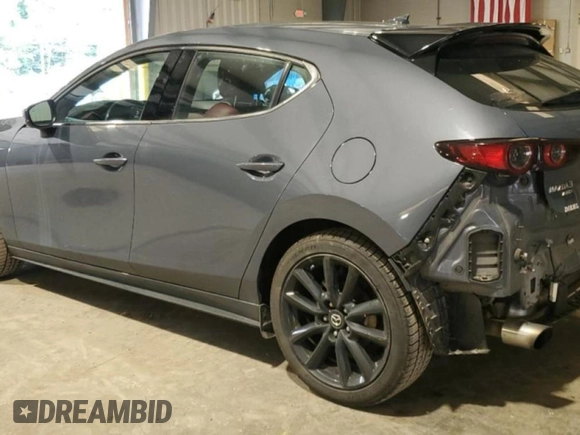 2021 Mazda 3 Premium Plus with VIN JM1BPBNYXM1311594, listed as a Copart auction lot 61470625 with 89,254 mi miles and Salvage title. Bid and sale history available at DreamBid. Image 2.