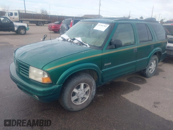 1999 Oldsmobile Bravada z VIN 1GHDT13W7X2711363, wystawiony jako IAAI lot #41294782 z przebiegiem 198 508 mil mil oraz . Historia ofert i sprzedaży dostępna na DreamBid. Obrazek 2.