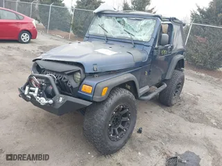2003 Jeep Wrangler X with VIN 1J4FA39S23P300447, listed as a IAAI auction lot 41791733 with 165,576 mi miles. Bid and sale history available at carsss.com. Image 2.