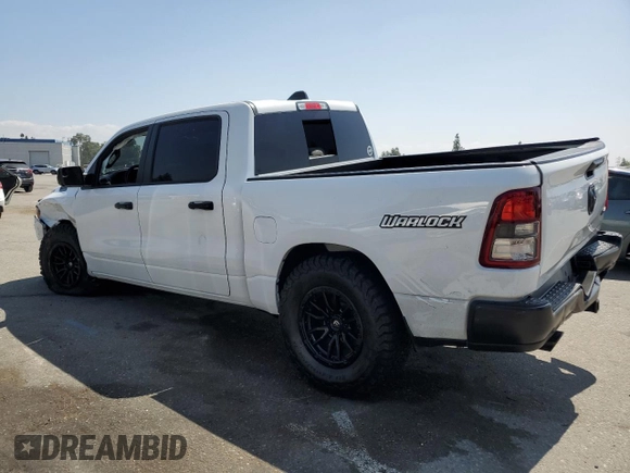 2023 Ram 1500 Tradesman with VIN 1C6SRFGT7PN684311, listed as a Copart auction lot 69792804 with 13,946 mi miles and Salvage title. Bid and sale history available at DreamBid. Image 2.