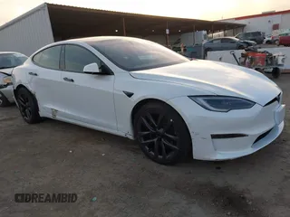2022 Tesla Model S with VIN 5YJSA1E57NF483768, listed as a IAAI auction lot 41069339 with 35,342 mi miles and . Bid and sale history available at DreamBid. Image 1.