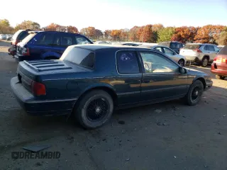 1992 Mercury Cougar z VIN 1MEPM6046NH628614, wystawiony jako Copart lot #77434664 z przebiegiem 83 518 mil mil oraz Szkody całkowita. Historia ofert i sprzedaży dostępna na DreamBid. Obrazek 3.