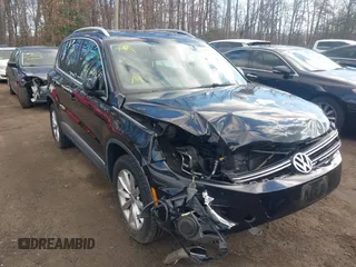 2017 Volkswagen Tiguan Wolfsburg Edition with VIN WVGRV7AX2HK001417, listed as a IAAI auction lot 41664334 with 91,841 mi miles and . Bid and sale history available at DreamBid. Image 1.