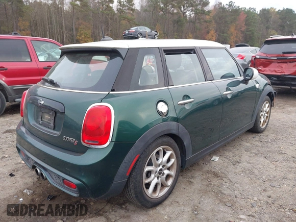 2015 MINI Hardtop 4 Door S with VIN WMWXU3C5XF2B59066, listed as a IAAI auction lot 40900773 with 14,618 mi miles and . Bid and sale history available at DreamBid. Image 4.