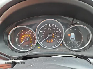 2018 Mazda CX-5 Touring z VIN JM3KFBCM4J0349687, wystawiony jako Copart lot #55857945 z przebiegiem Nie podano mil oraz Szkoda całkowita • Salvage title. Historia ofert i sprzedaży dostępna na DreamBid. Obrazek 9.