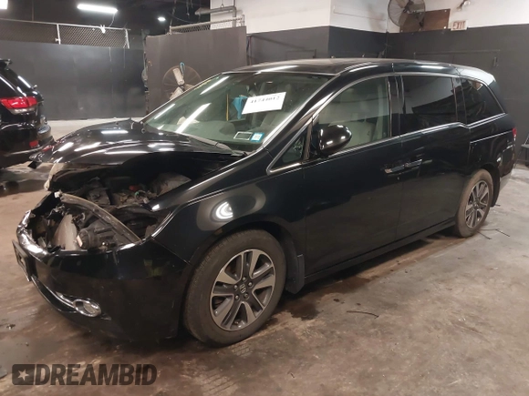 2014 Honda Odyssey Touring with VIN 5FNRL5H94EB105745, listed as a IAAI auction lot 41744012 with 77,032 mi miles and . Bid and sale history available at DreamBid. Image 2.