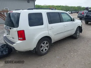 2011 Honda Pilot Touring z VIN 5FNYF4H96BB106873, wystawiony jako IAAI lot #42154795 z przebiegiem 162 282 mil mil oraz . Historia ofert i sprzedaży dostępna na DreamBid. Obrazek 4.