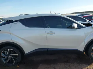 2021 Toyota C-HR LE with VIN JTNKHMBX3M1114590, listed as a IAAI auction lot 41560459 with 61,803 mi miles. Bid and sale history available at carsss.com. Image 13.