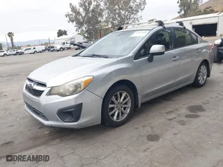 2012 Subaru Impreza Sedan 2.0i Premium with VIN JF1GJAC68CH026374, listed as a IAAI auction lot 42063409 with 160,167 mi miles. Bid and sale history available at carsss.com. Image 2.