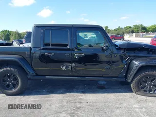 2021 Jeep Gladiator Willys with VIN 1C6HJTAGXML613431, listed as a IAAI auction lot 42180502 with 64,572 mi miles and . Bid and sale history available at DreamBid. Image 13.