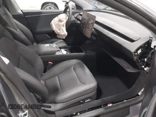2024 Tesla Model 3 Long Range with VIN 5YJ3E1EB0RF860736, listed as a IAAI auction lot 41966827 with 5,134 mi miles and . Bid and sale history available at DreamBid. Image 5.