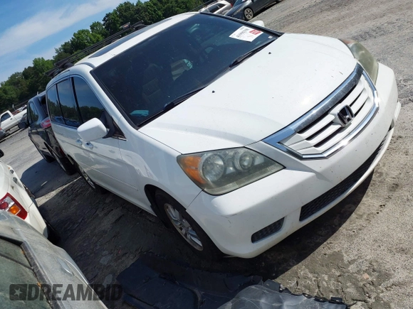 2009 Honda Odyssey EX-L with VIN 5FNRL38799B404379, listed as a IAAI auction lot 41990398 with 224,859 mi miles and . Bid and sale history available at DreamBid. Image 1.
