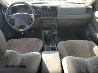 1999 Isuzu Rodeo S z VIN 4S2CM58W0X4306727, wystawiony jako Copart lot #74758994 z przebiegiem 193 850 mil mil oraz Tytuł czysty. Historia ofert i sprzedaży dostępna na DreamBid. Obrazek 8.