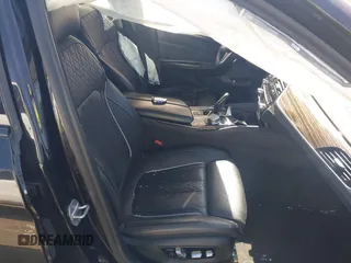 2019 BMW 5 Series M550i xDrive with VIN WBAJB9C51KB464879, listed as a IAAI auction lot 41774834 with 77,379 mi miles and . Bid and sale history available at DreamBid. Image 5.