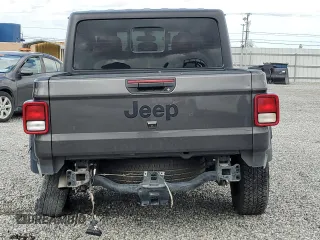 2023 Jeep Gladiator Freedom with VIN 1C6JJTAG9PL557861, listed as a Copart auction lot 50452955 with 44,716 mi miles and Salvage title. Bid and sale history available at DreamBid. Image 6.