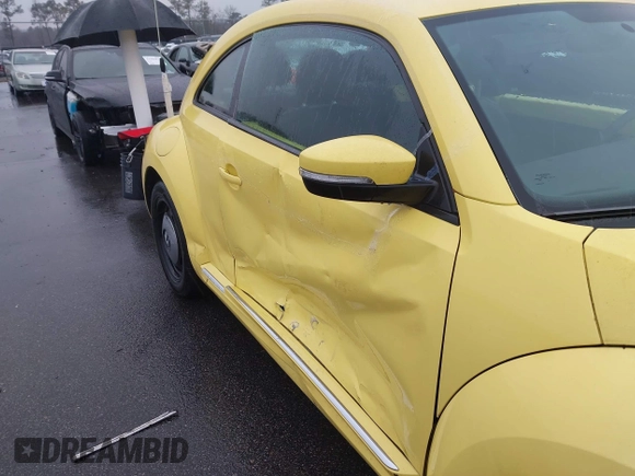 2013 Volkswagen Beetle 2.5L with VIN 3VWHX7AT7DM613197, listed as a IAAI auction lot 41298890 with 130,219 mi miles and . Bid and sale history available at DreamBid. Image 17.