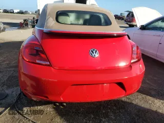 2014 Volkswagen Beetle 1.8T w/Premium z VIN 3VW517AT9EM819966, wystawiony jako Copart lot #76990014 z przebiegiem Nie podano mil oraz Nie do naprawy • Non repairable. Historia ofert i sprzedaży dostępna na DreamBid. Obrazek 6.